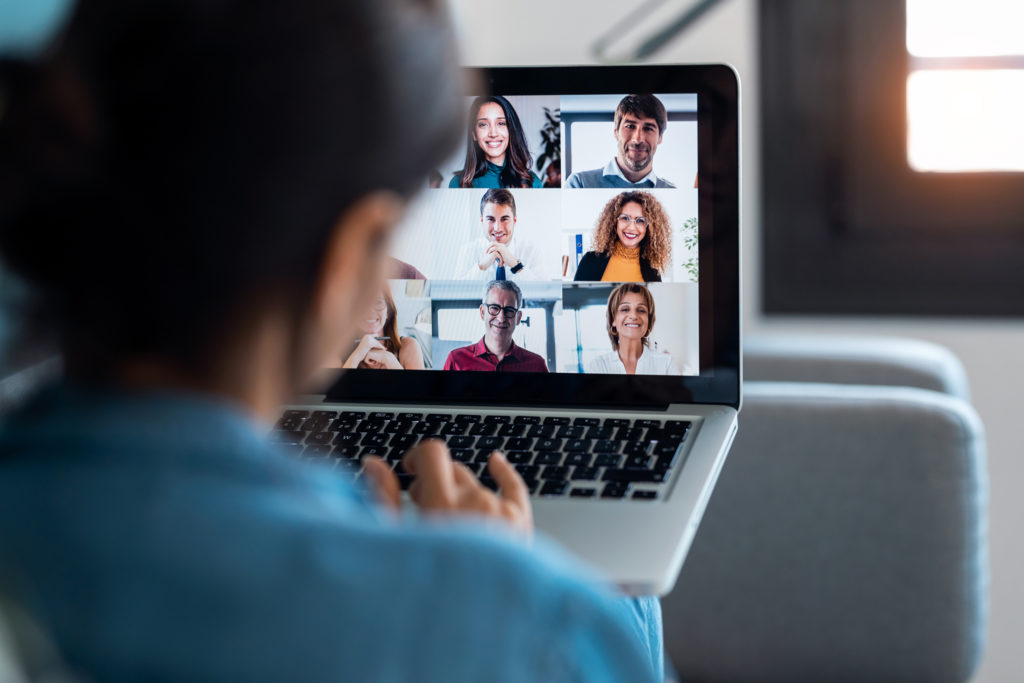 Business woman speaking on video call with diverse colleagues on