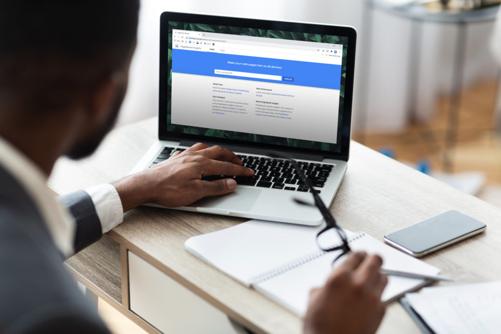 Black businessman working on laptop on his workplace