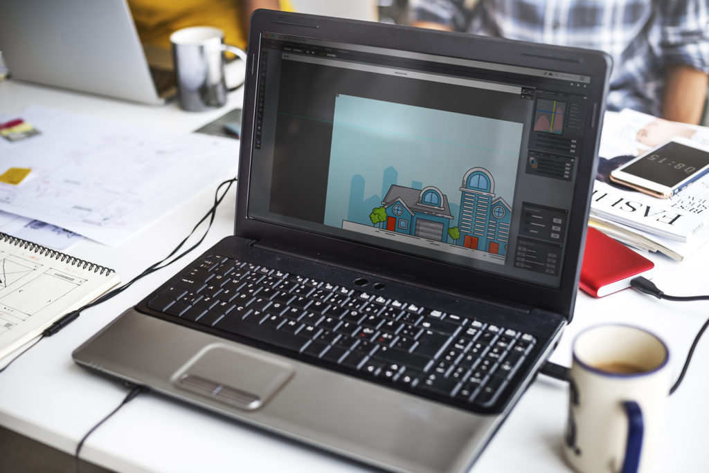 Laptop Screen Showing Graphic House Exterior Design on Desktop