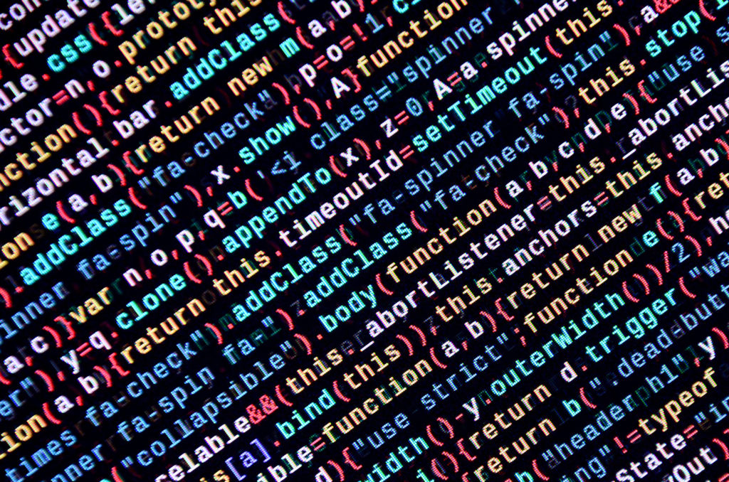 Javascript functions, variables, objects. Monitor closeup of function source code. IT specialist workplace