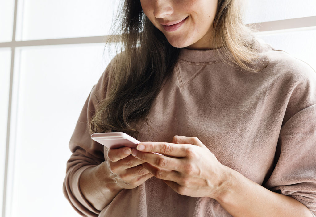 Woman using a smarphone social media conecpt