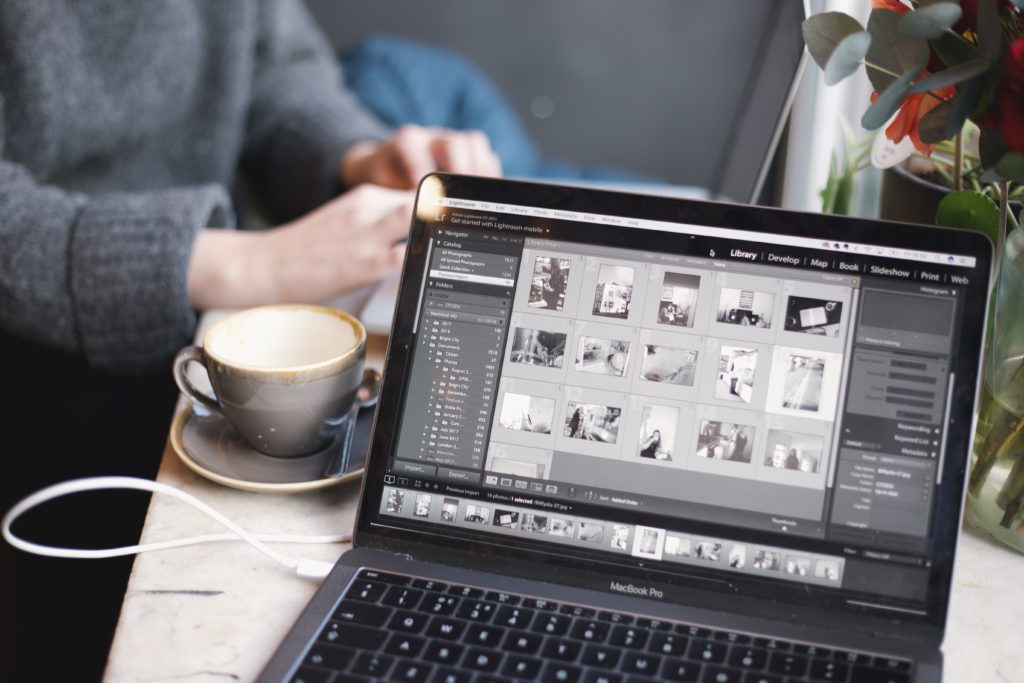 laptop with cup of coffee on the side