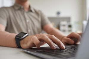 Man typing on computer