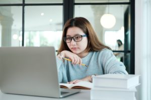 Woman looking at her laptop